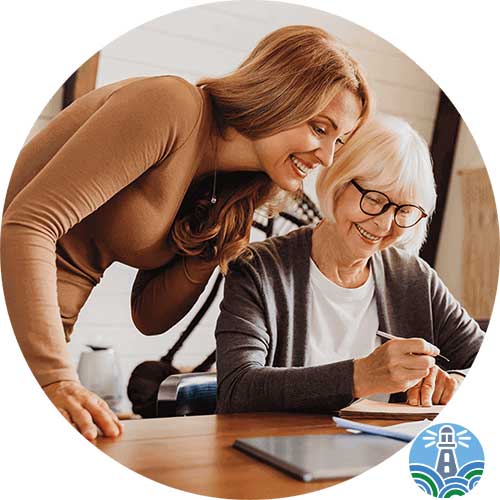 Advisor consulting with retired woman at home.